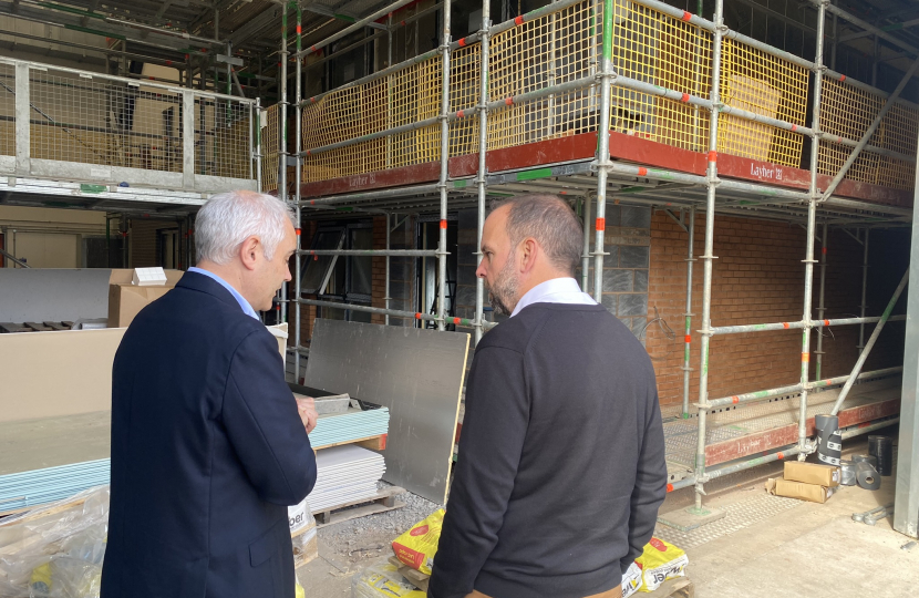 James Daly MP sees the work being done by the University of Salford to ensure homes are well insulated